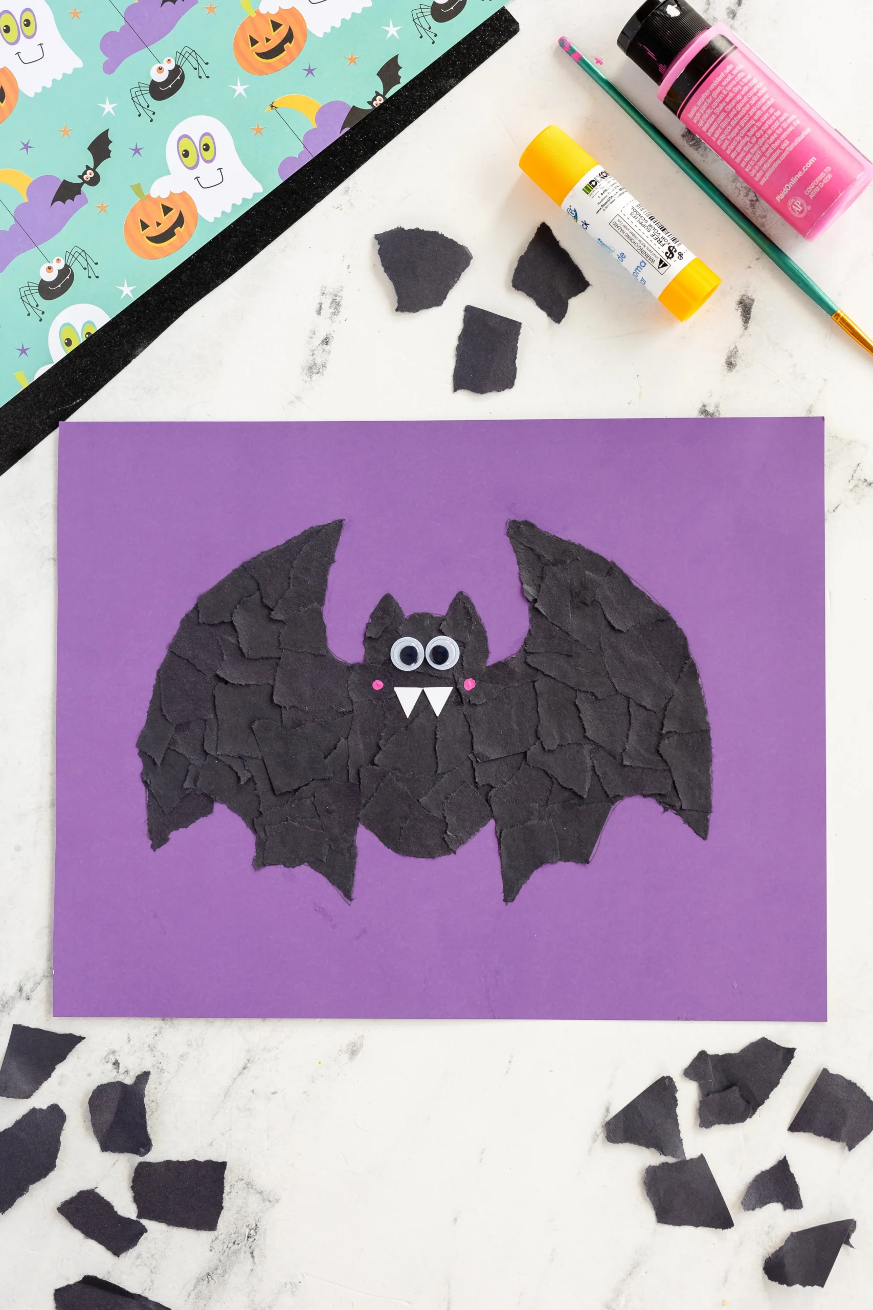 Halloween bat craft decorations made from paper and crafts supplies.