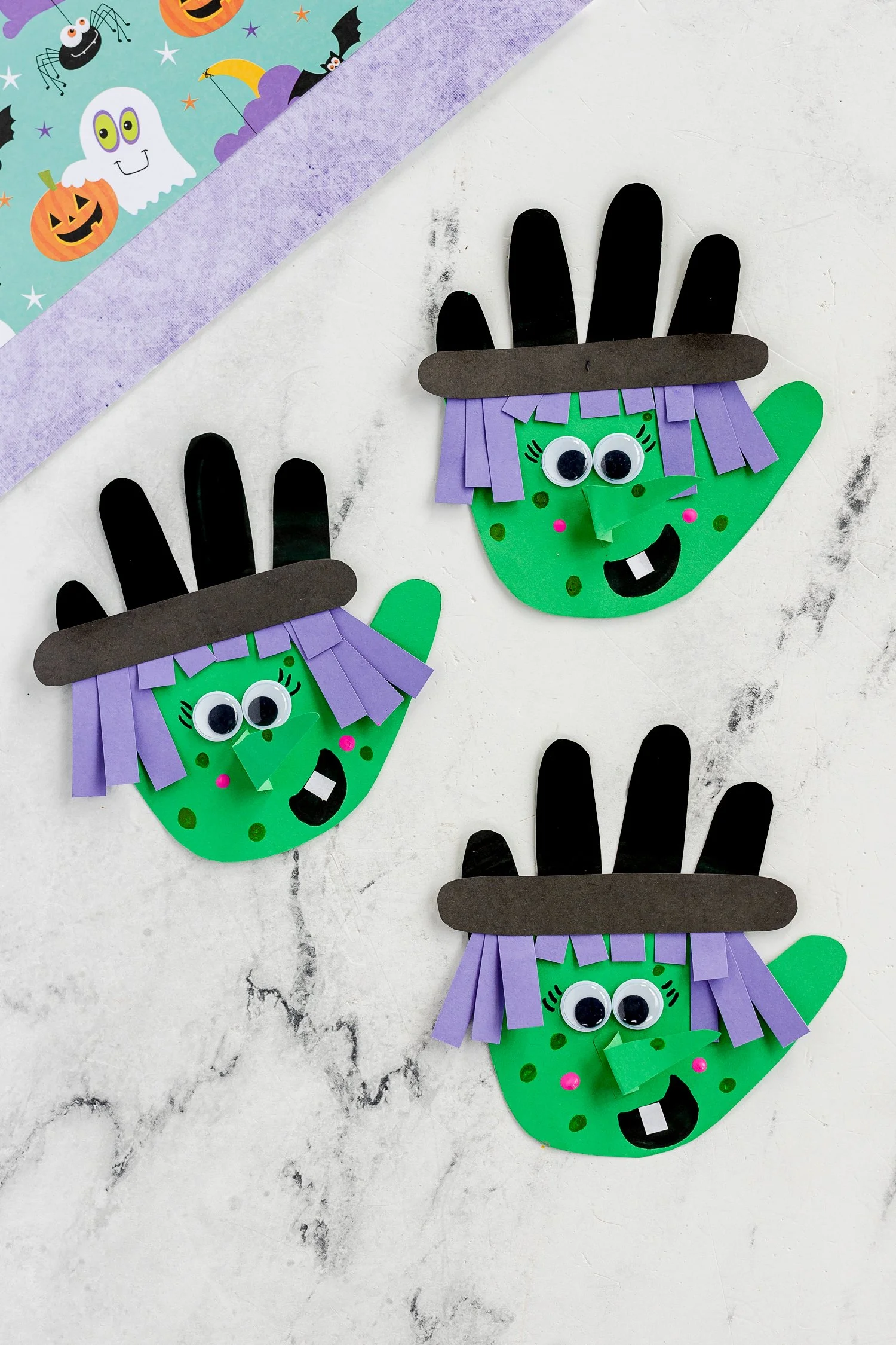 Colorful handprint witch craft for kids activities