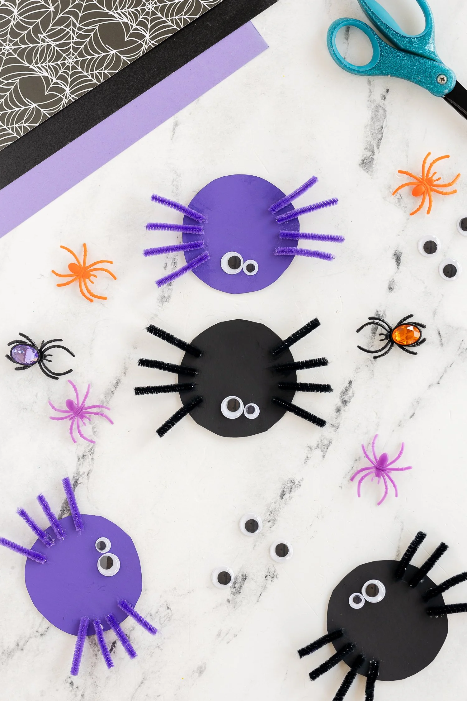 Colorful pipe cleaner spiders crafted for Halloween decoration