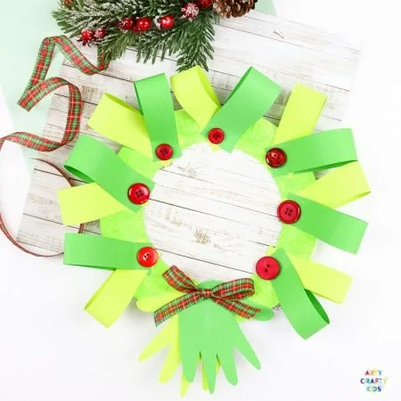 Paper plate handprint Christmas wreath craft for kids