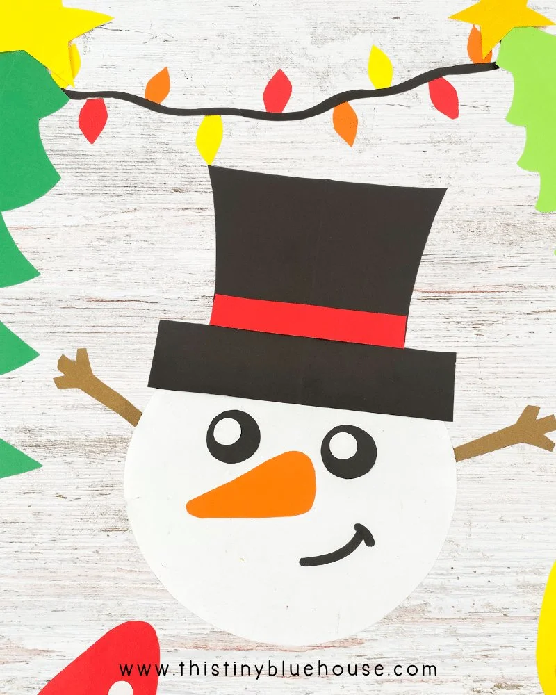 Fun printable snowman craft for kids featured in This Tiny Blue House.