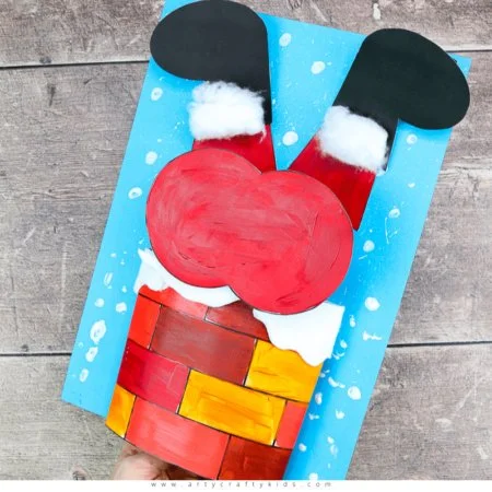 Creative Christmas craft of Santa stuck in the chimney for kids