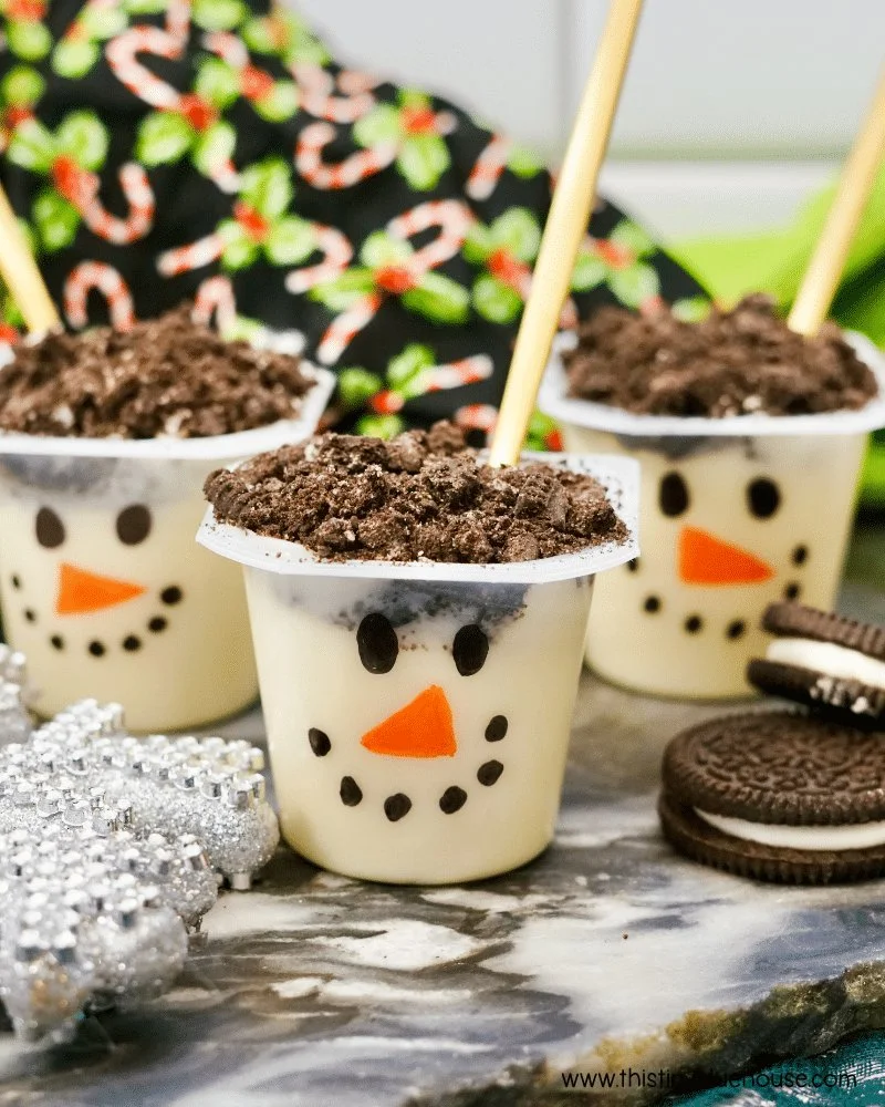 Festive Snowman Pudding Cups decorated for winter holidays