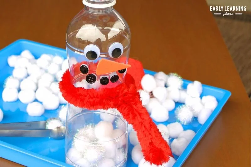 Kids engaged in a snowman activity for fine motor skills during winter.